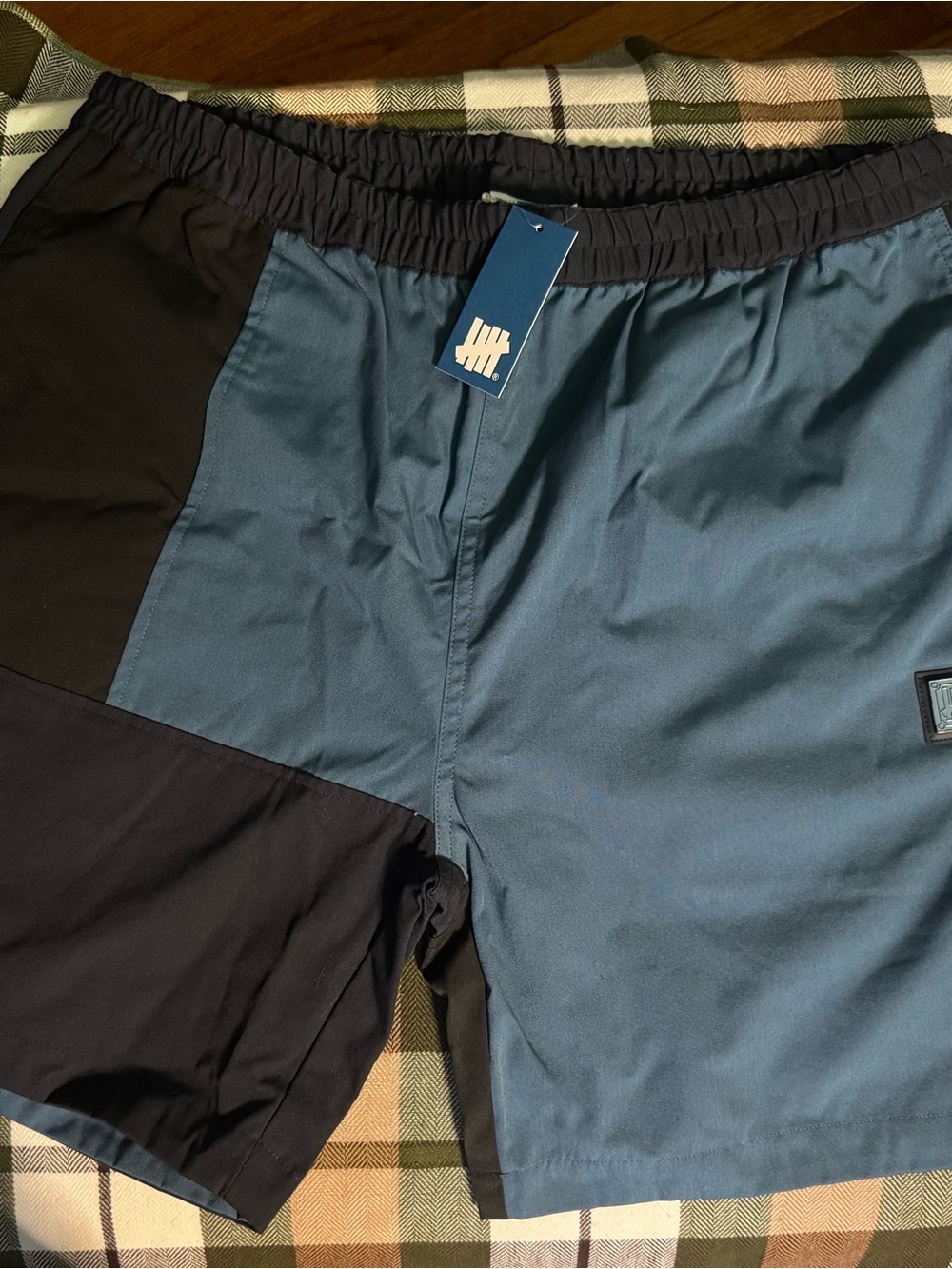 Undefeated Two-Tone Swim Shorts in Blue and Black